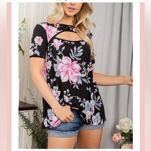 Black  floral top with short sleeves and oval cutout in neckline.
